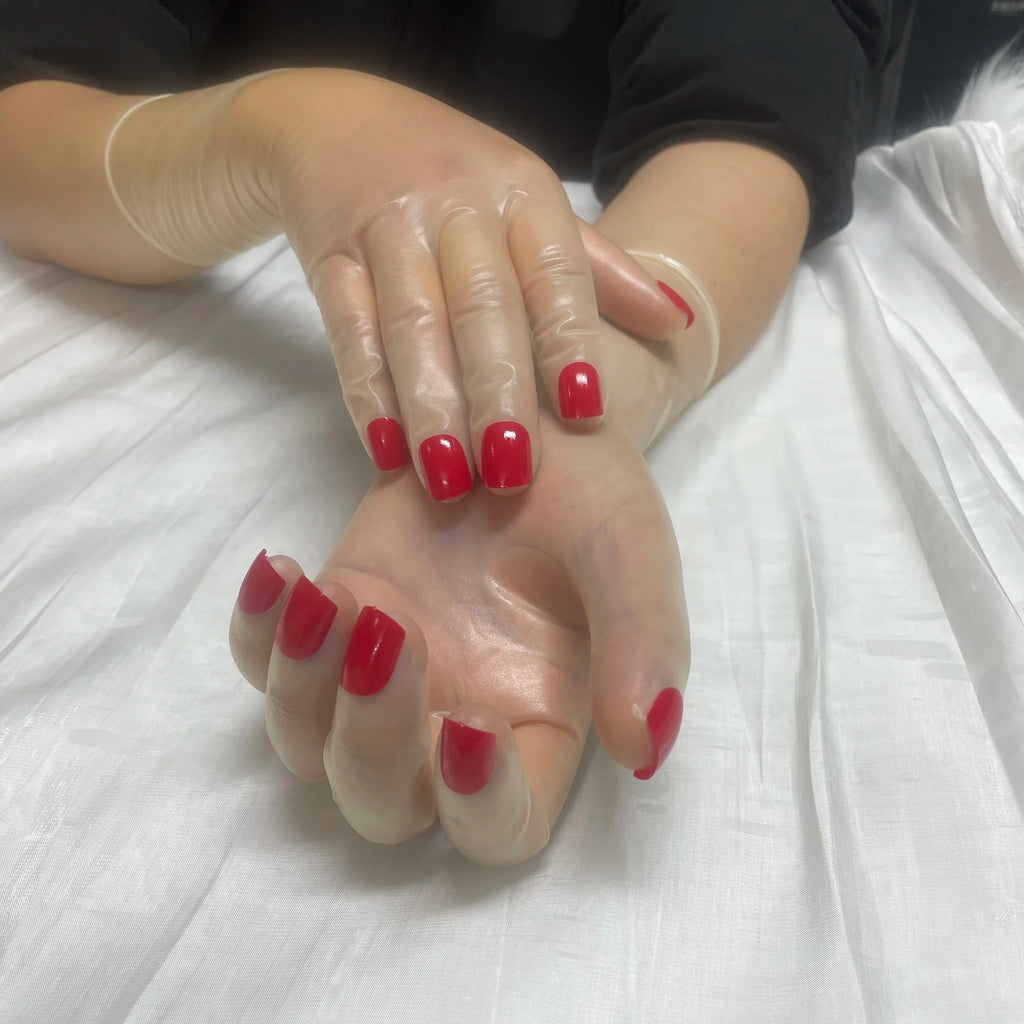 A pair of Malaysian latex material supper thin transparent shiny shiny male to female latex medium long gloves with nail service