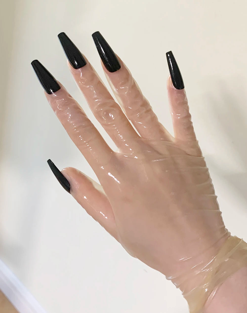 A pair of Malaysian latex material supper thin transparent shiny shiny male to female latex medium long gloves with nail service