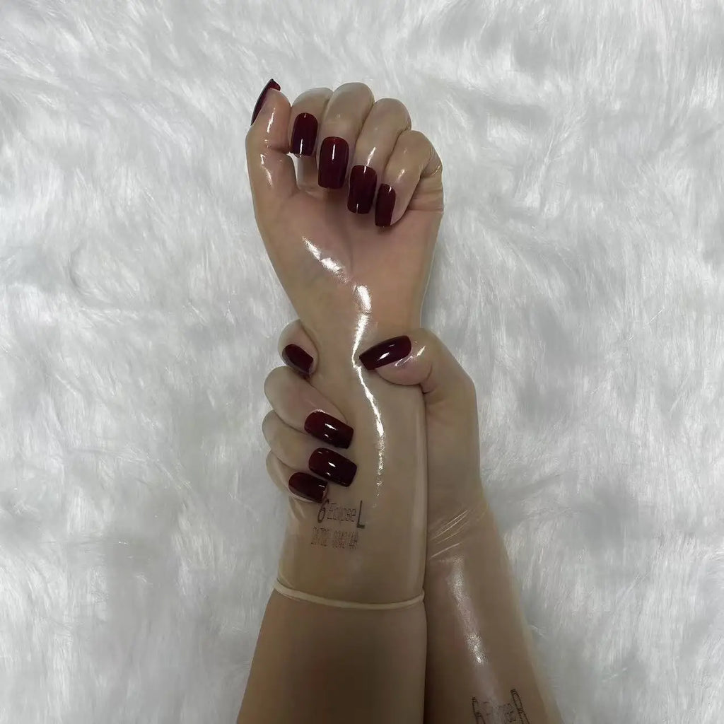 A pair of Malaysian latex material supper thin transparent shiny shiny male to female latex medium long gloves with nail service