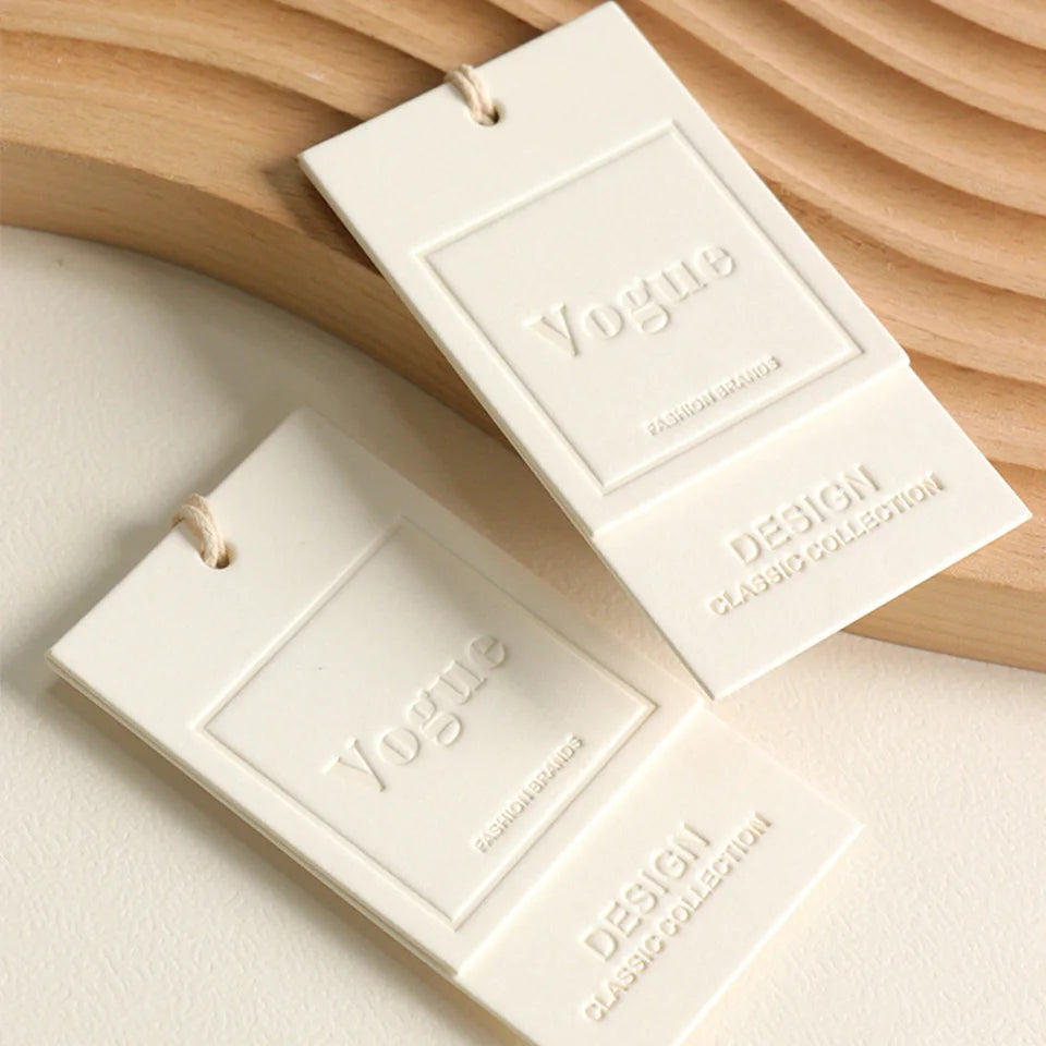 Custom Luxury Garment Swing Tag Clothing Brand Price Label 3D Embossed logo Paper hang Tag
