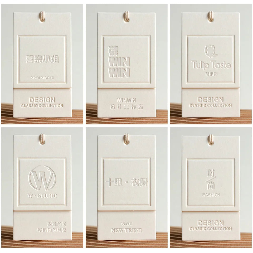 Custom Luxury Garment Swing Tag Clothing Brand Price Label 3D Embossed logo Paper hang Tag