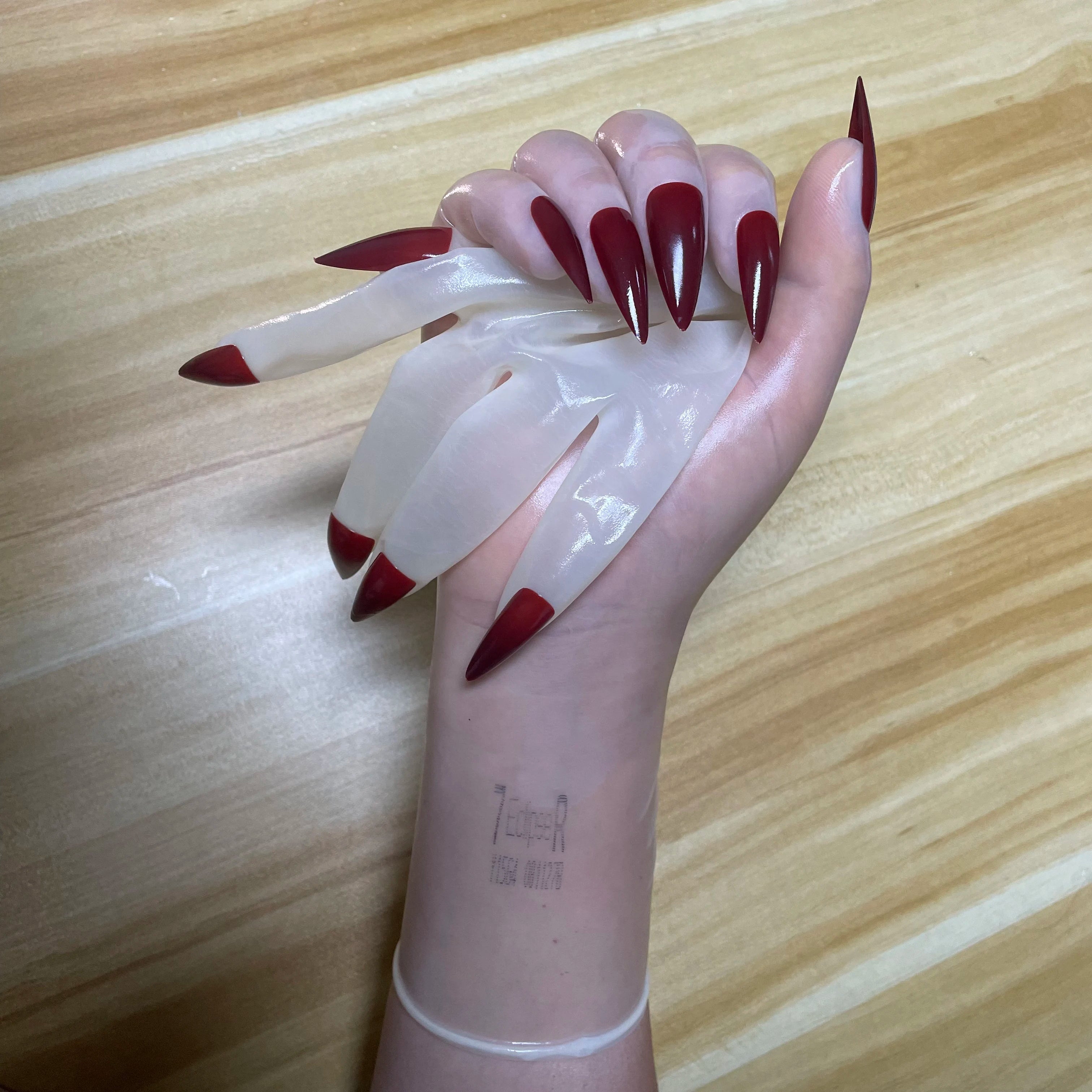 A pair of Malaysian latex material supper thin transparent shiny shiny male to female latex medium long gloves with nail service