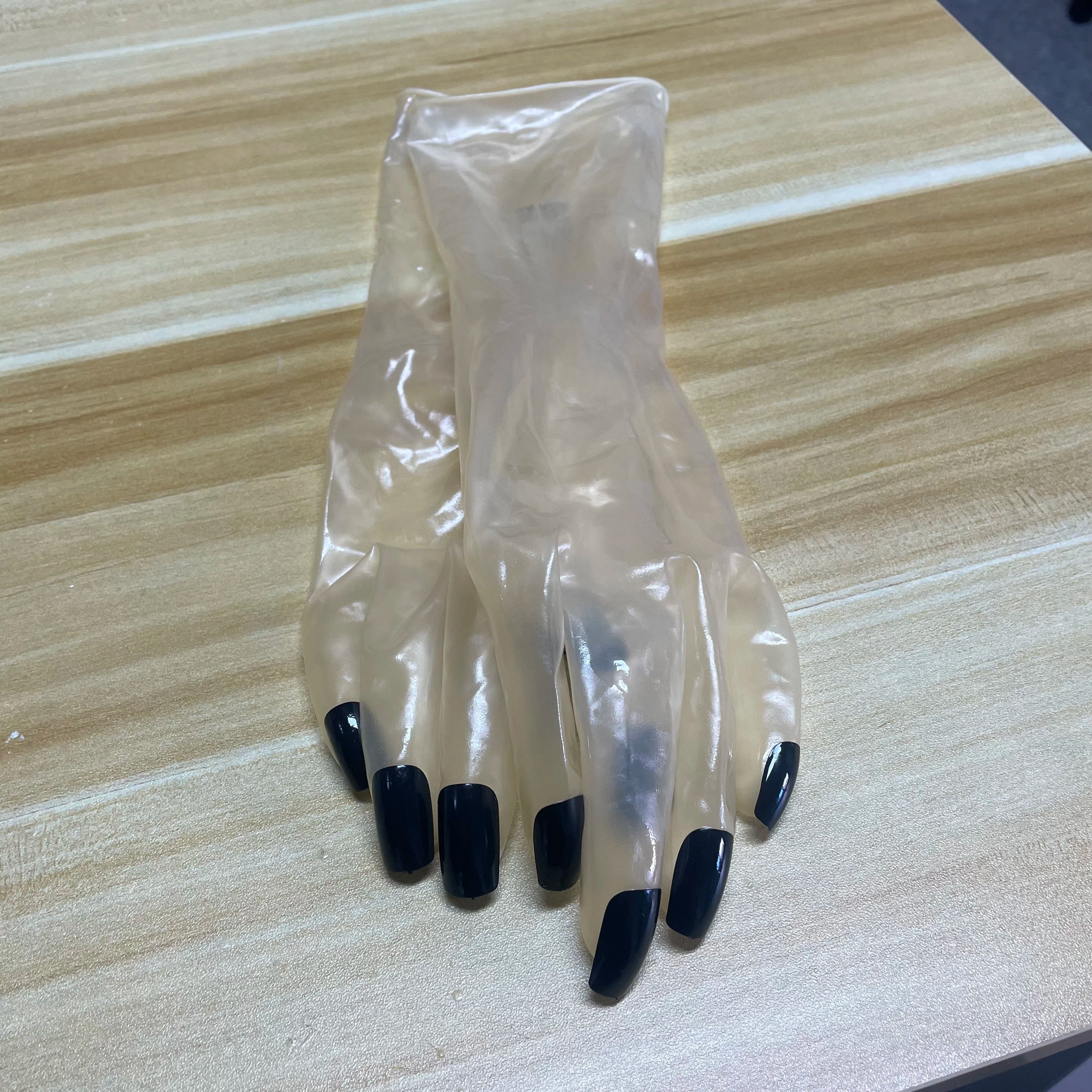 A pair of Malaysian latex material supper thin transparent shiny shiny male to female latex medium long gloves with nail service