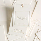 Custom Luxury Garment Swing Tag Clothing Brand Price Label 3D Embossed logo Paper hang Tag