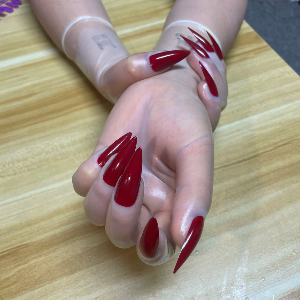 A pair of Malaysian latex material supper thin transparent shiny shiny male to female latex medium long gloves with nail service